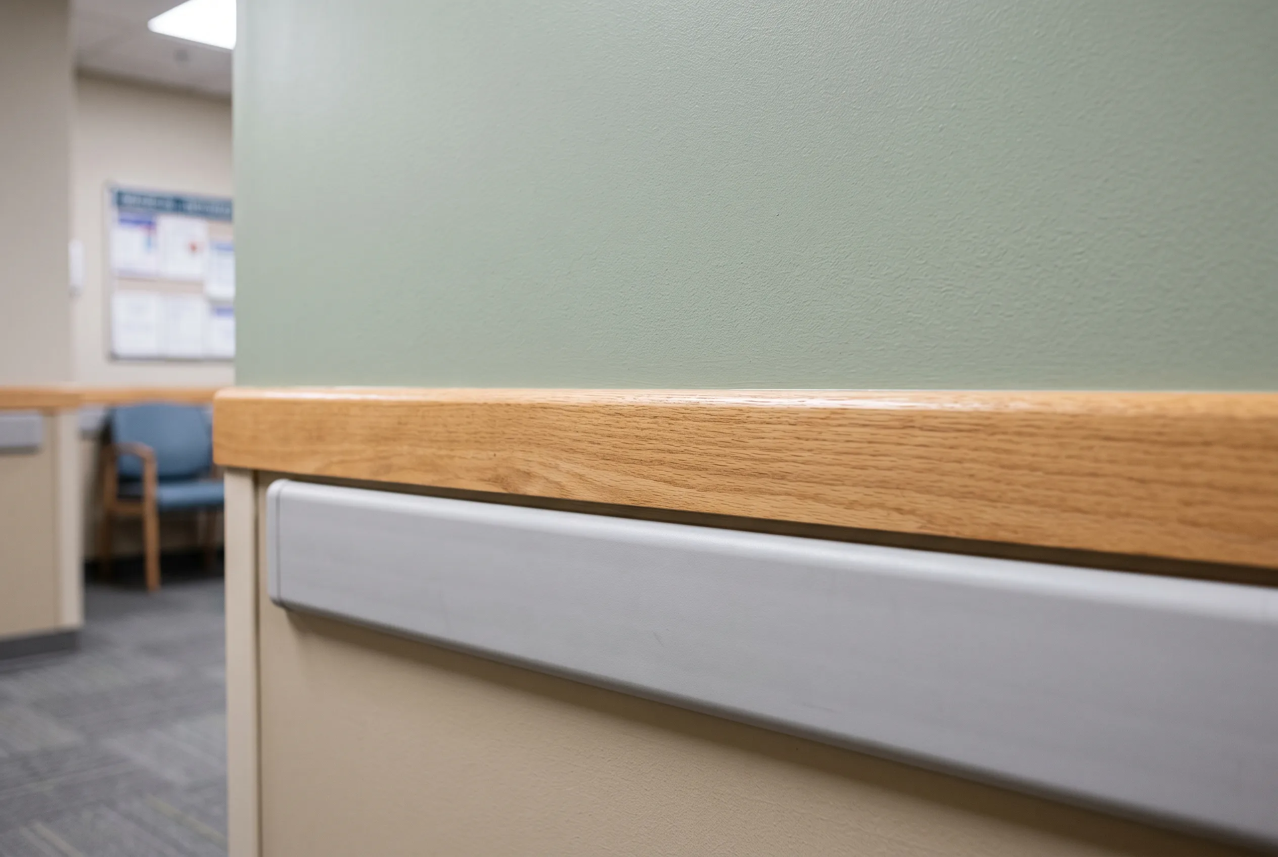 Close-up of a freshly painted wall and handrail in a healthcare facility