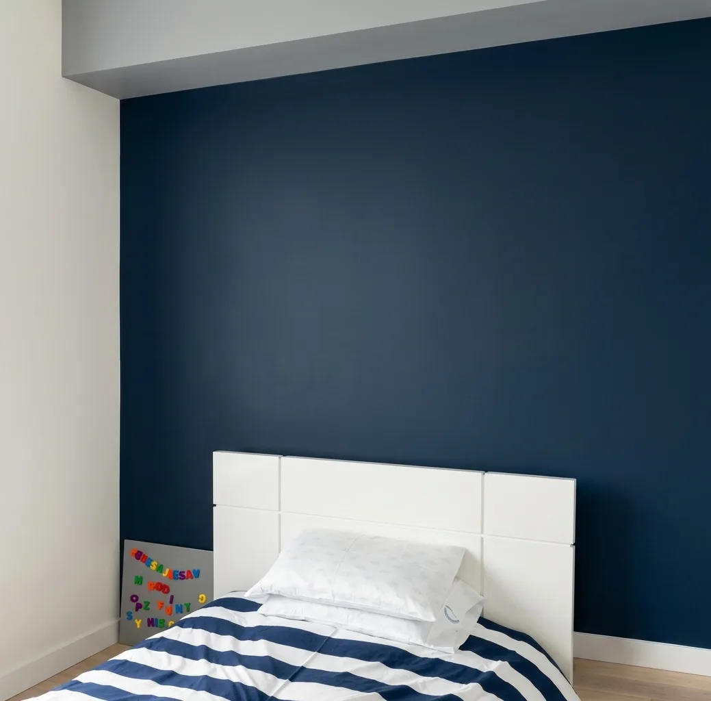 Bedroom with a newly painted navy accent wall