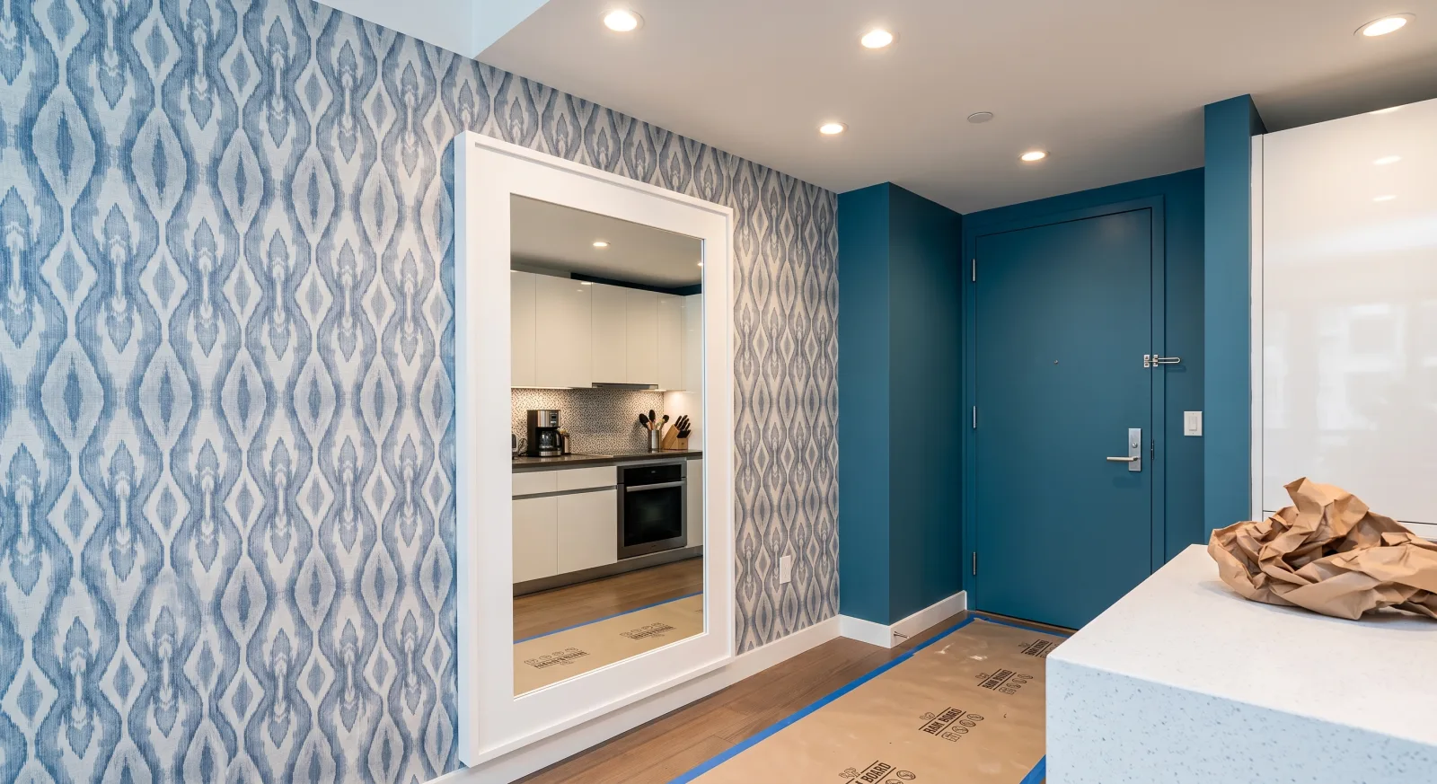 Apartment hallway after wallpaper installation by GCA Painting