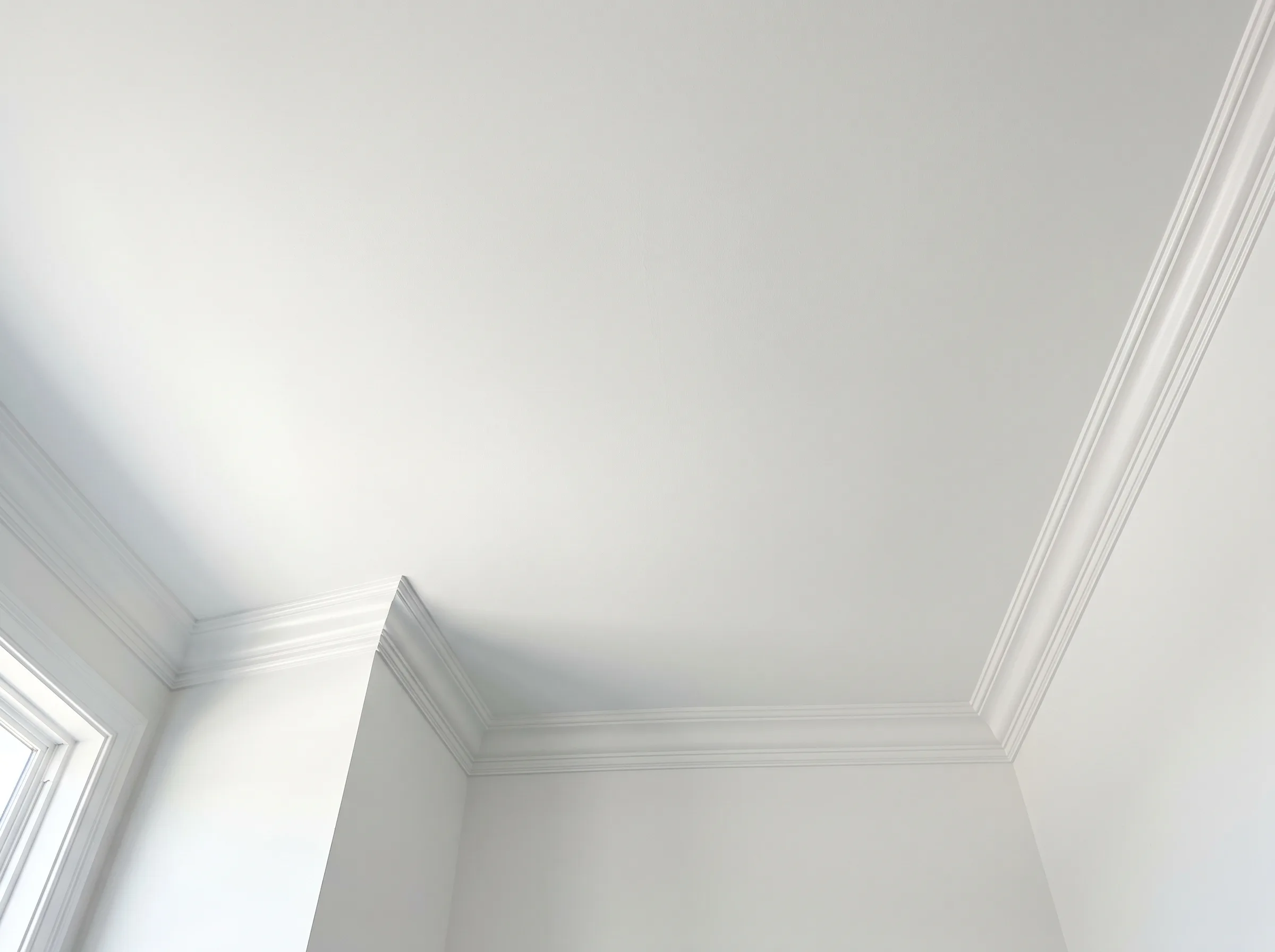 Close-up of crown molding detail after a finished repair and paint job