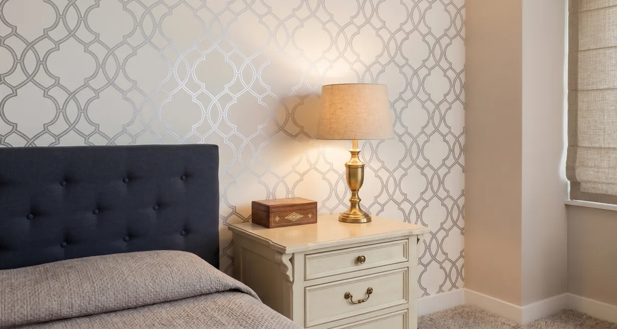 Bedroom accent wall with newly installed patterned wallpaper